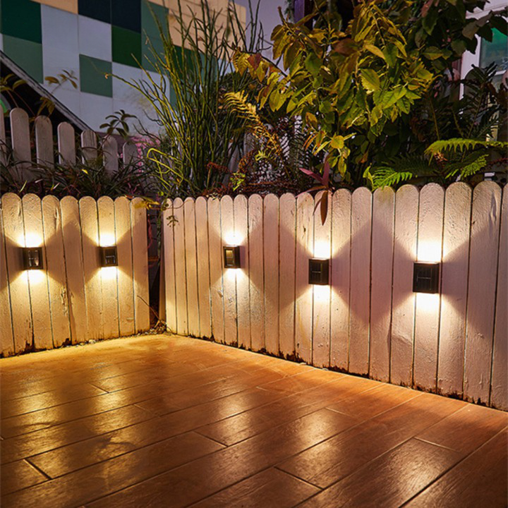 Energy-efficient solar LED wall lamp, automatic wireless outdoor lighting for bright garden & pathway illumination.