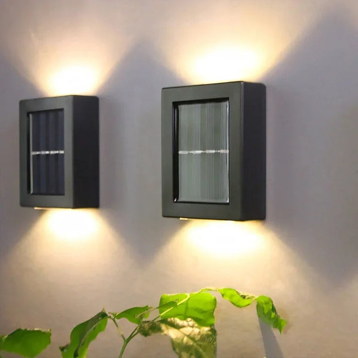 Bright solar-powered LED wall lamp installed, providing wireless security and energy-efficient driveway lighting.