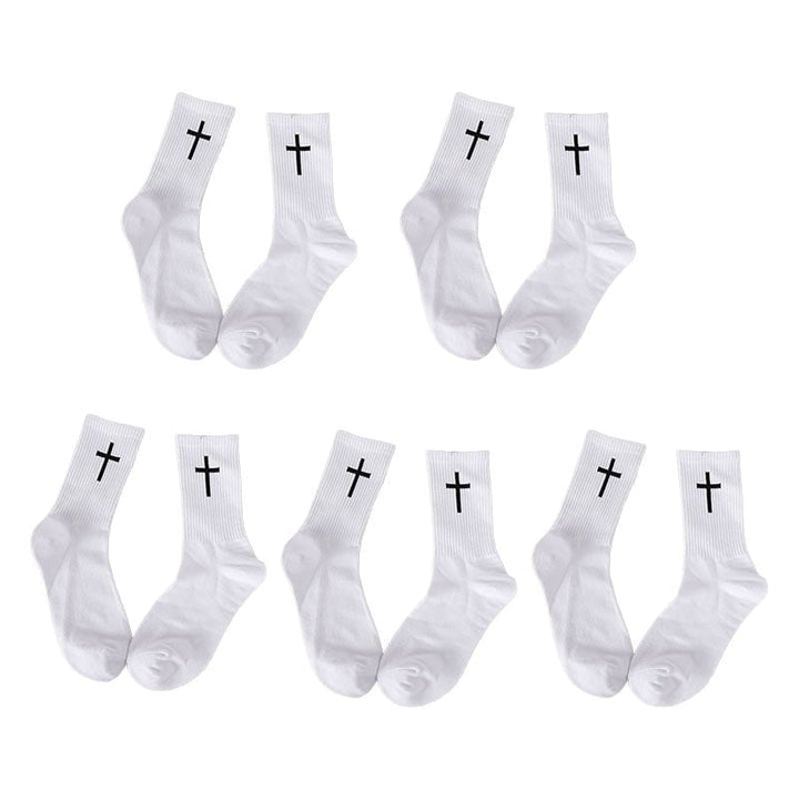 Detail shot of the elastic cuff and cross pattern on a black unisex cotton ankle sock