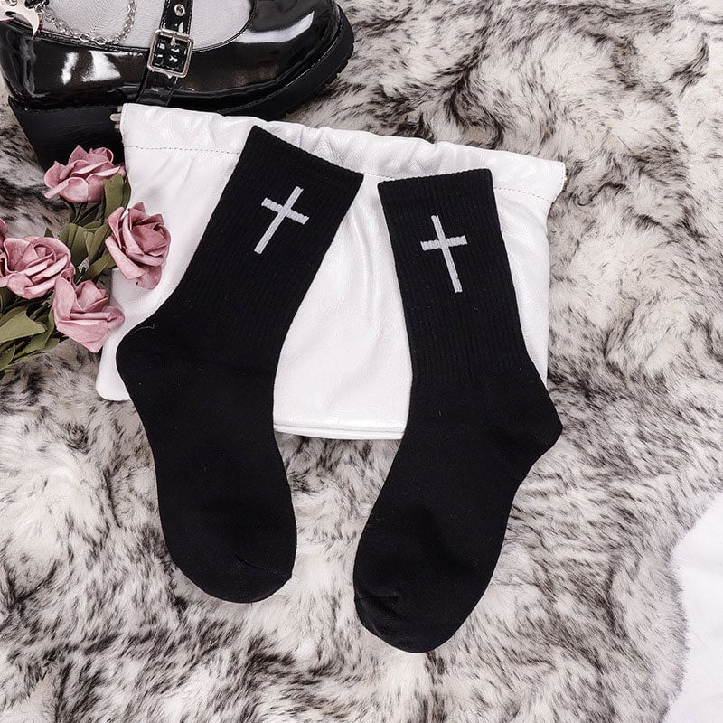 Black unisex ankle socks featuring a modern white cross design, comfortable cotton blend