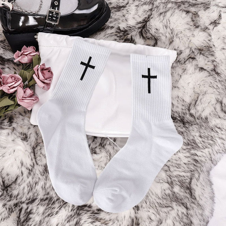 Unisex black ankle socks with graphic white cross, ideal for casual and comfortable wear