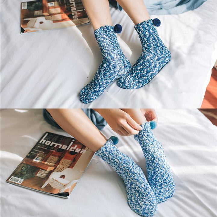 Collection of various colored women's fluffy cupcake slipper socks, showcasing different 'frosting' designs.
