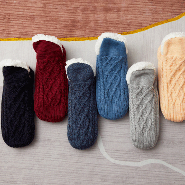 Unisex fluffy slipper socks folded neatly, showcasing their soft acrylic texture and readiness as a cozy gift.
