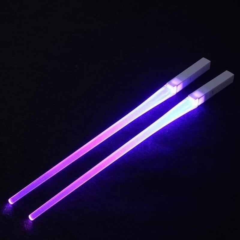 Unisex novelty Lightsaber LED chopsticks, green and blue, used for a playful dining experience.