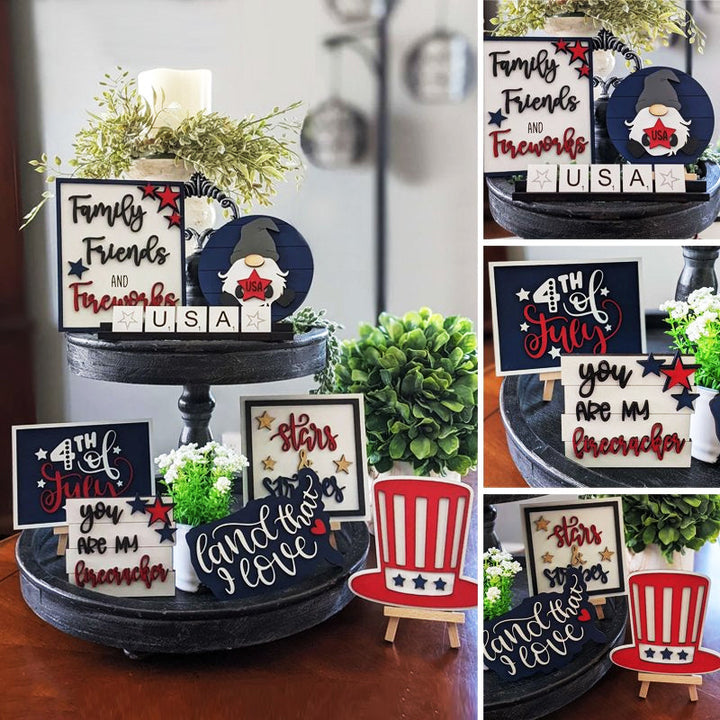 Hand-painted wooden signs with patriotic themes from an Americana tiered tray decor assortment.