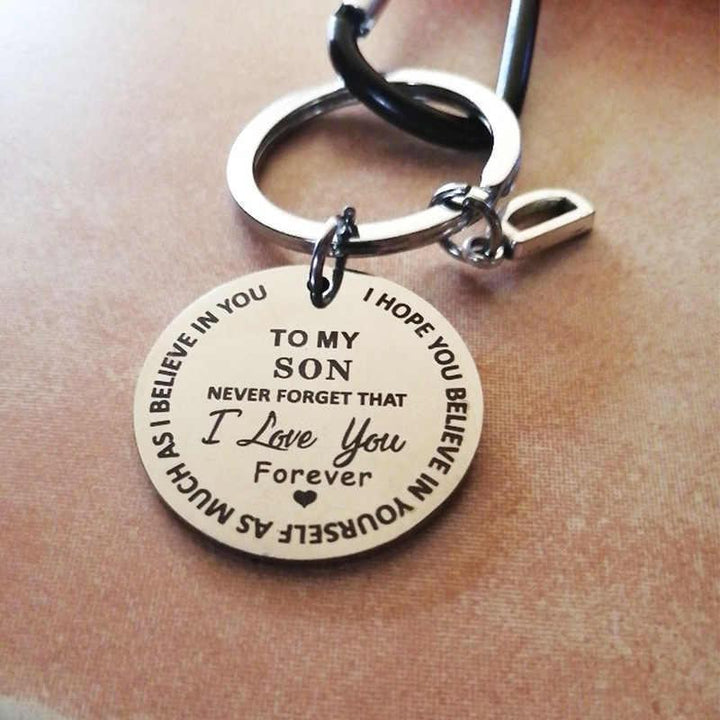 Close-up of a personalized initial 'J' keychain, made of stainless steel, ideal as a sentimental accessory gift.