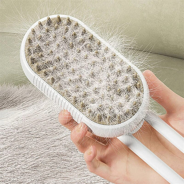 Pet Steam Grooming Brush in action on a fluffy cat, showing effective fur removal & happy pet