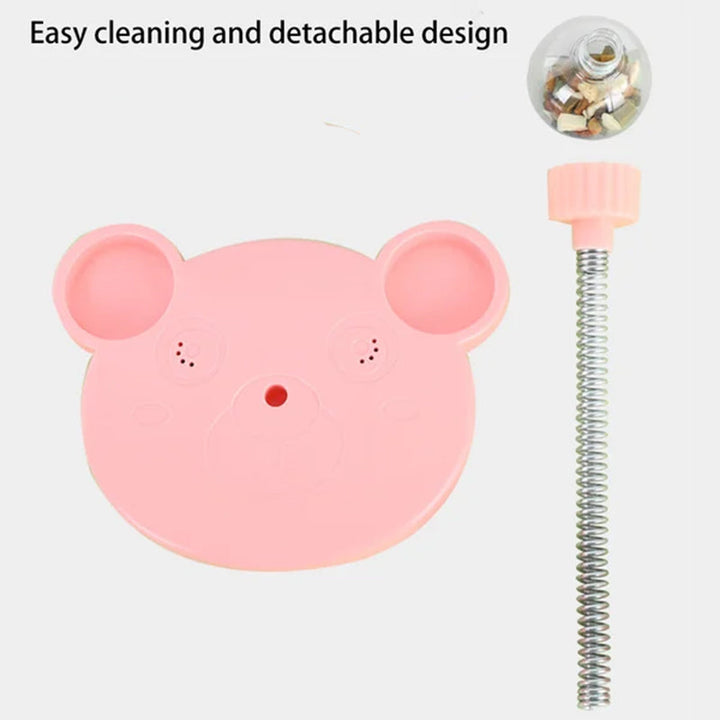 Detail of unique design on pink interactive treat dispenser toy for pets