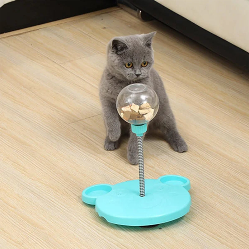Two interactive pet treat dispenser toys (pink & blue) for cats and dogs