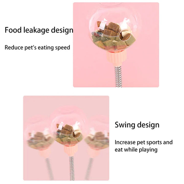 Cat batting at a pink interactive treat dispenser, engaging brain activity