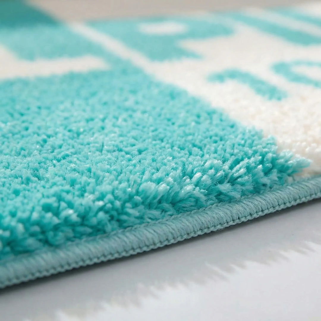 Soft, modern pink pill-shaped accent rug with unique wavy Flowique design for stylish interiors.
