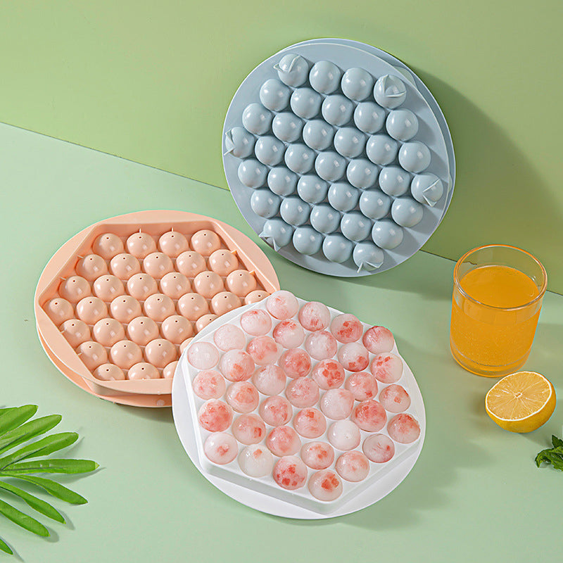 Pink sphere ice ball maker mold, perfect for kitchen barware and cocktails.