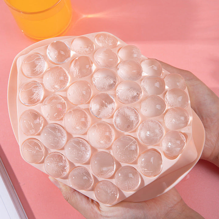 Blue sphere ice ball maker mold for drinks, freezer-friendly kitchen essential.