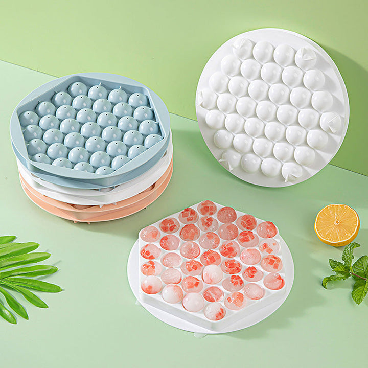 Top-down shot of a blue sphere ice mold, ideal for chilling barware drinks.