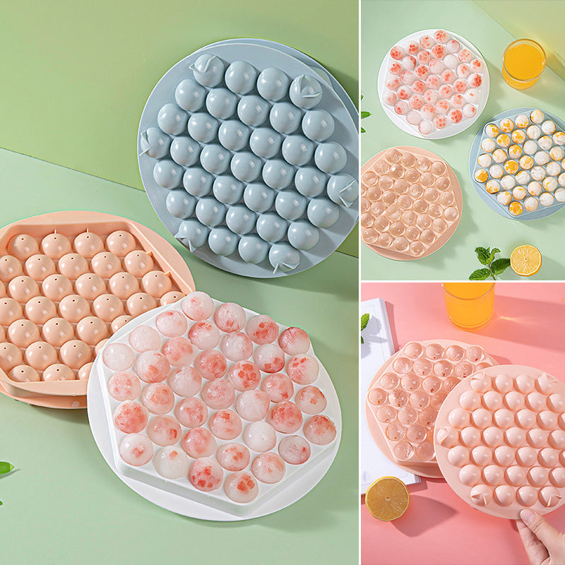 Ice ball mold, pink, producing a perfectly spherical ice for barware and drinks.
