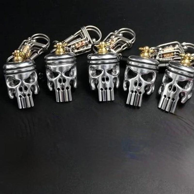 Vintage-look Piston Art Skull Keychain, handmade with care, unique metal accessory.