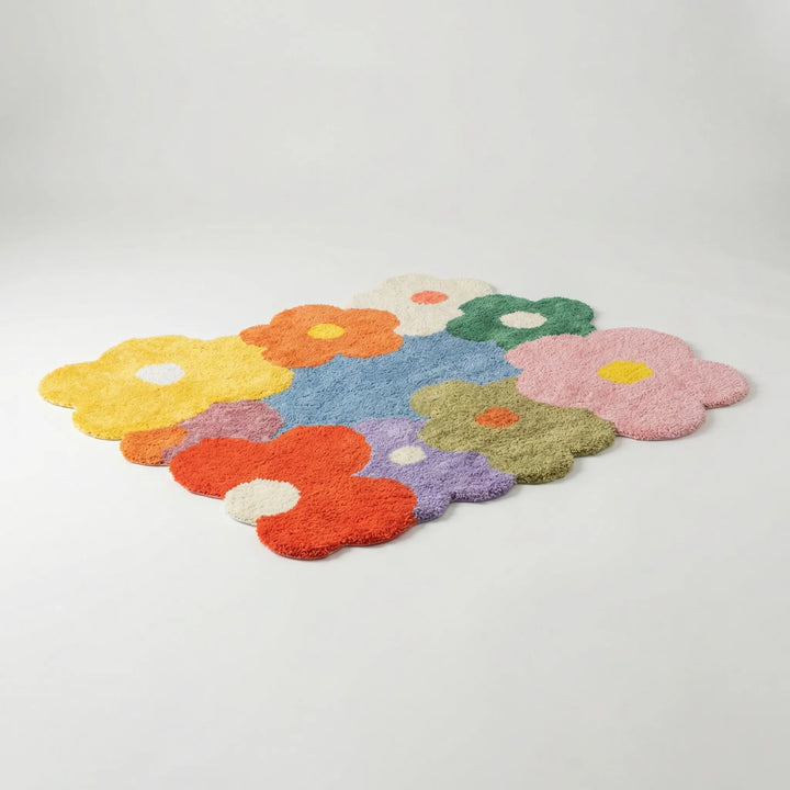 Vibrant Flowique floral area rug, a playful statement piece with wavy design for bohemian living rooms and bedrooms.