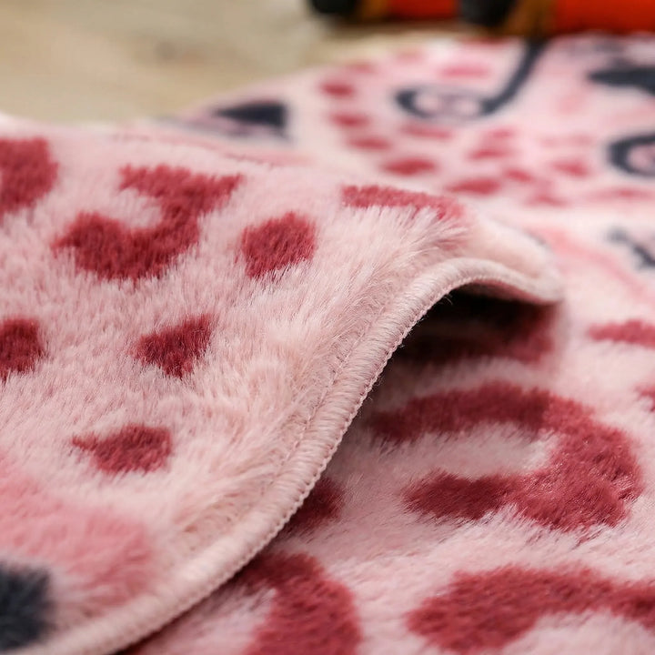 Modern novelty leopard accent rug with a playful wave pattern. Enhance your home decor with this soft, eye-catching floor piece.