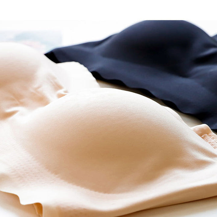 Plus size strapless push up bra in a delicate lace pattern, maintaining invisibility.