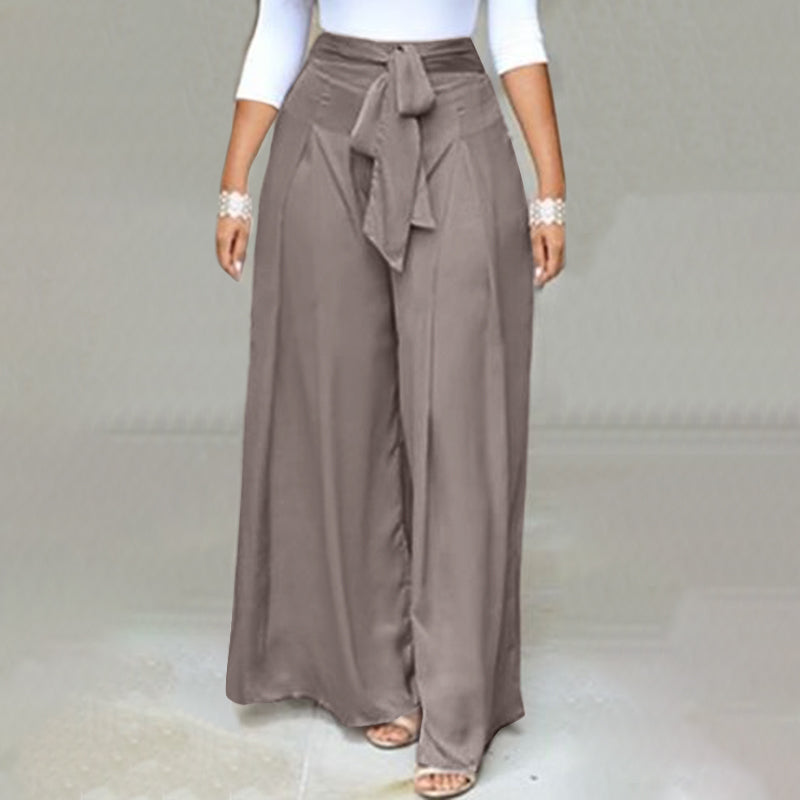 Plus-size women's black wide-leg palazzo pants. Comfortable, high-waist professional office attire.