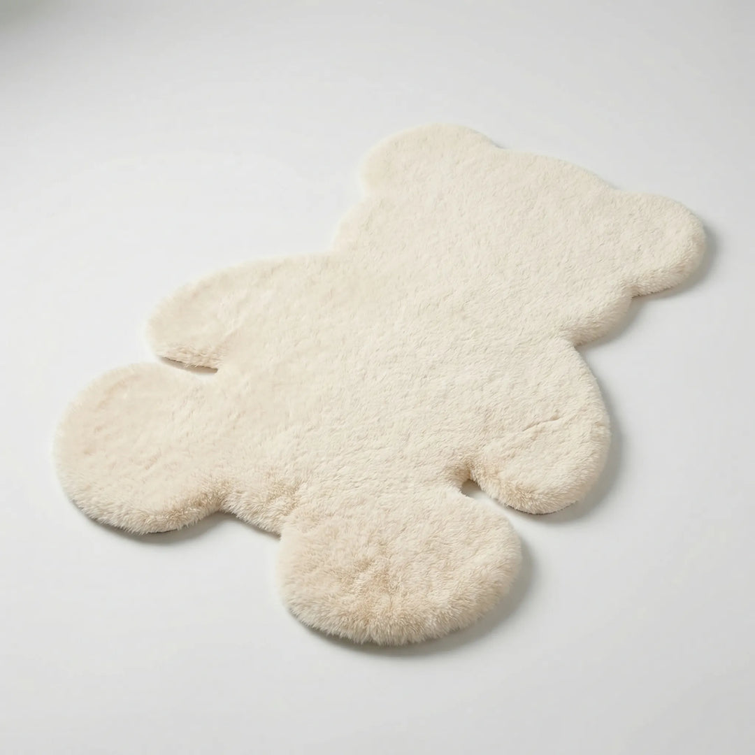 Flowique bear-shaped plush area rug with subtle waves, adding a soft, cozy accent to any room decor.