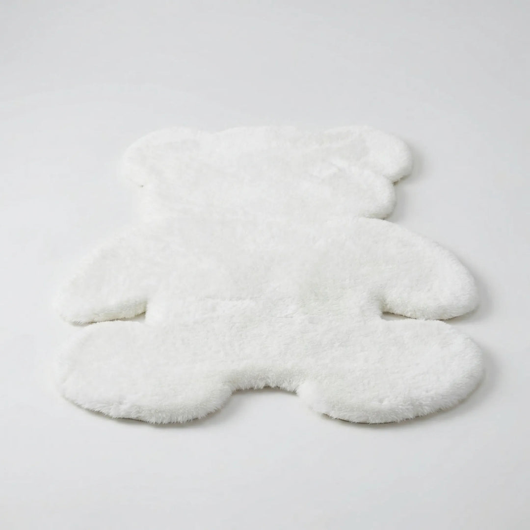 Unique bear-shaped plush area rug with wavy texture, a cozy statement piece for modern home decor.