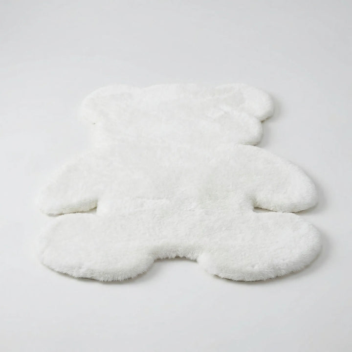 Unique bear-shaped plush area rug with wavy texture, a cozy statement piece for modern home decor.