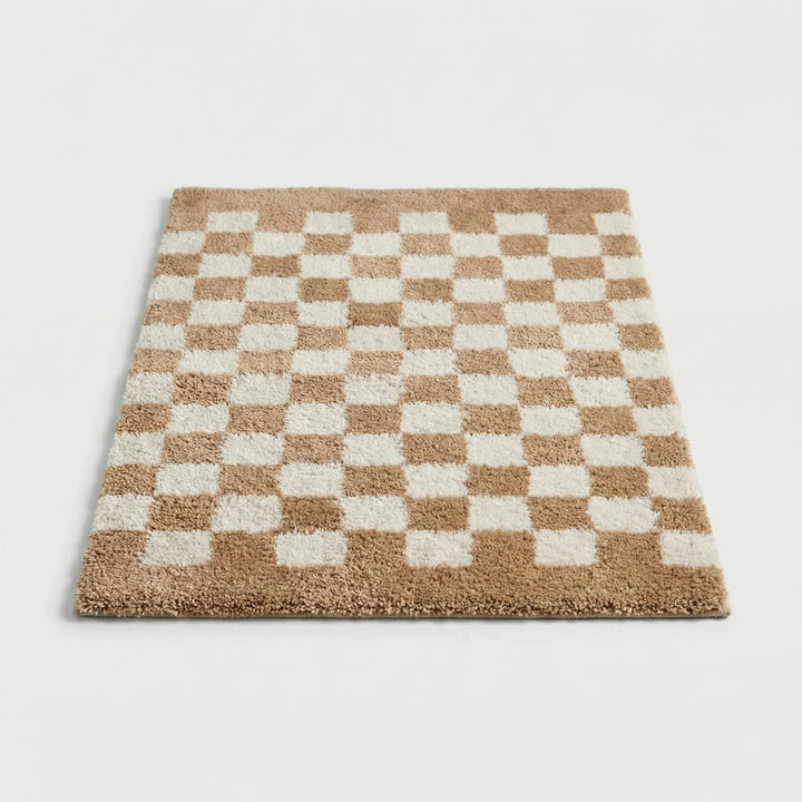 Non-slip checkered bath mat in plush fabric, perfect for safe bathroom decor.