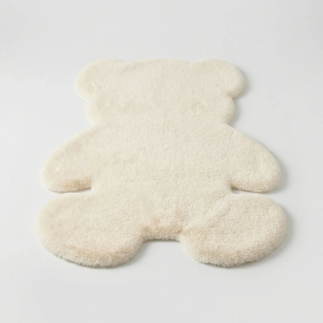 Cozy plush bear area rug, incredibly soft texture, perfect for a kids' room or warm home decor.