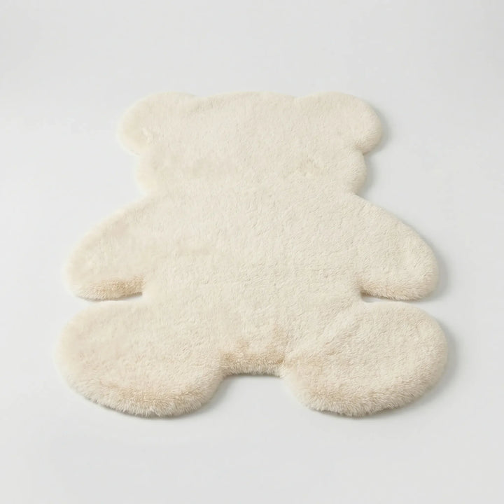 Cozy plush bear area rug, incredibly soft texture, perfect for a kids' room or warm home decor.