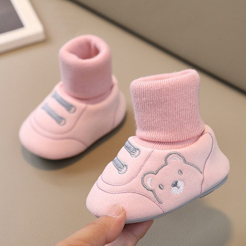 Gift-ready display of assorted plush baby winter booties, newborn shoes