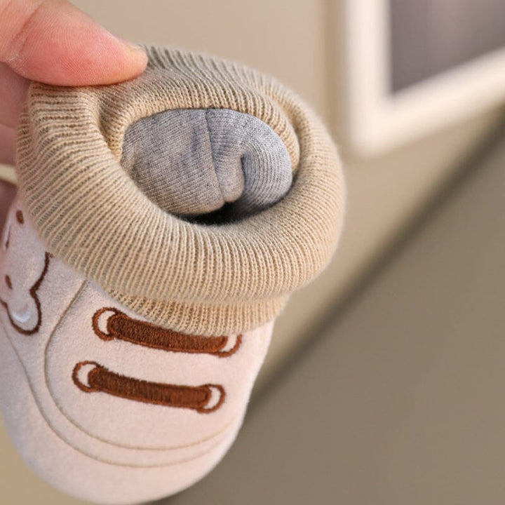 Detail of the non-slip soft sole on plush baby winter booties