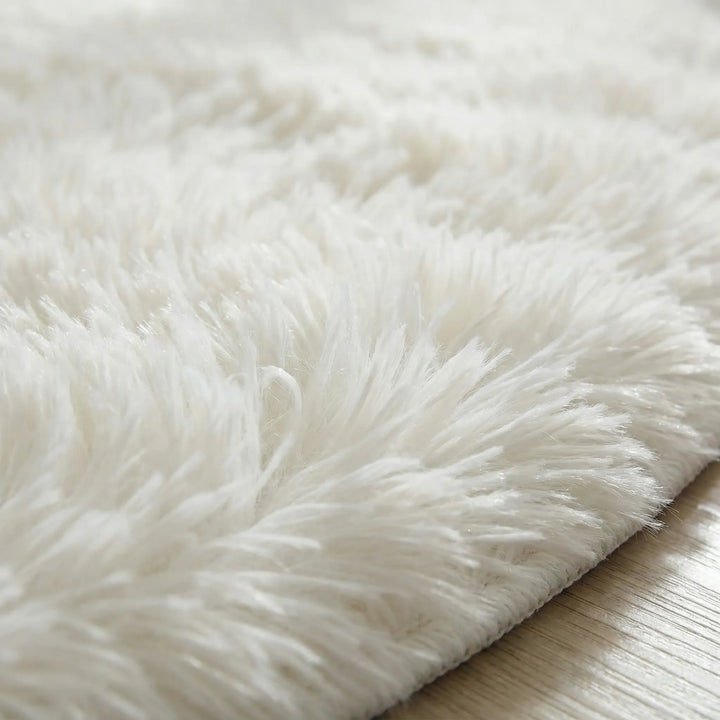 Neutral round plush rug with a unique wave design. Ultra-soft area rug, ideal for cozy living room or bedroom decor.
