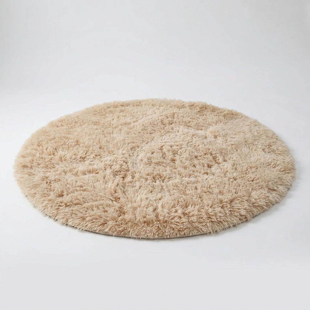 Soft plush round high pile area rug with Flowique wave pattern. Cozy floor decor for bedroom, living room, or kids' room.
