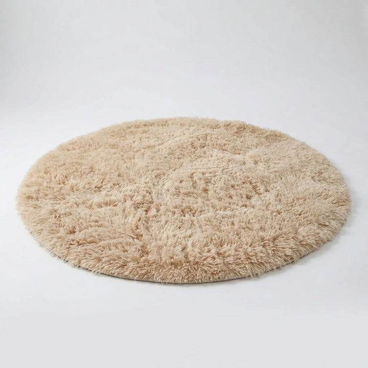 Soft plush round high pile area rug with Flowique wave pattern. Cozy floor decor for bedroom, living room, or kids' room.