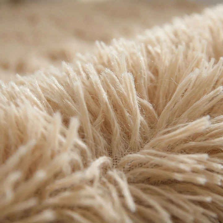 Cozy round plush high pile area rug with a unique wavy design. Perfect soft statement piece for any modern home decor.
