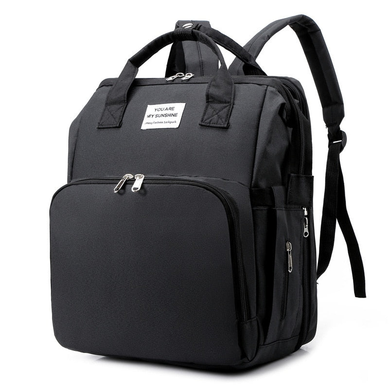 Portable baby bed, diaper bag & travel backpack in one. Ideal for baby travel & essentials.