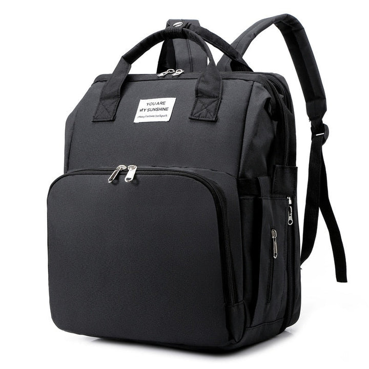 Portable baby bed, diaper bag & travel backpack in one. Ideal for baby travel & essentials.