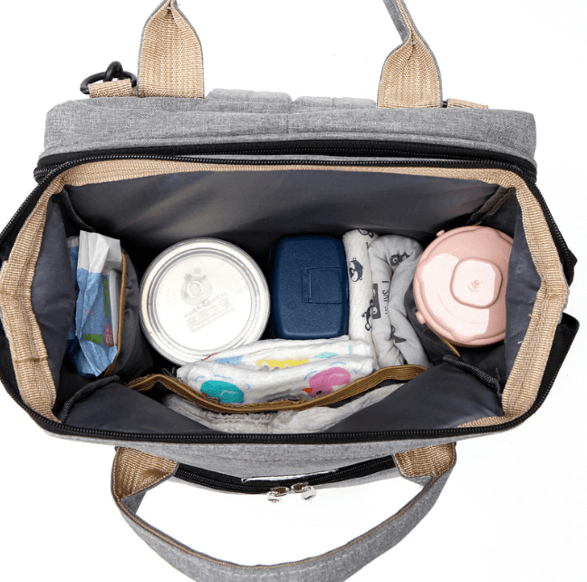 On-the-go baby travel solution: portable bed, changing station & diaper bag backpack.