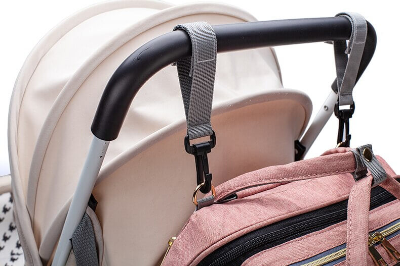 Compact portable baby bed & nappy bag, a stress-free baby travel solution.