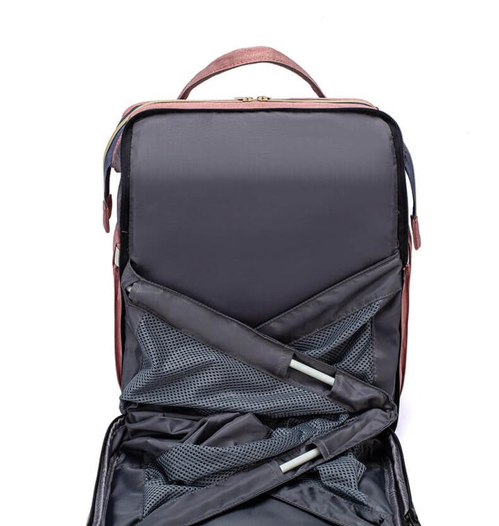 Close-up of high-quality waterproof fabric on a portable baby bed & diaper backpack.