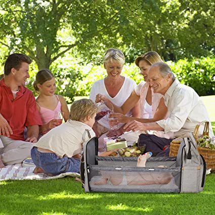 Ergonomic, padded straps on a multi-function portable baby bed & diaper bag backpack.