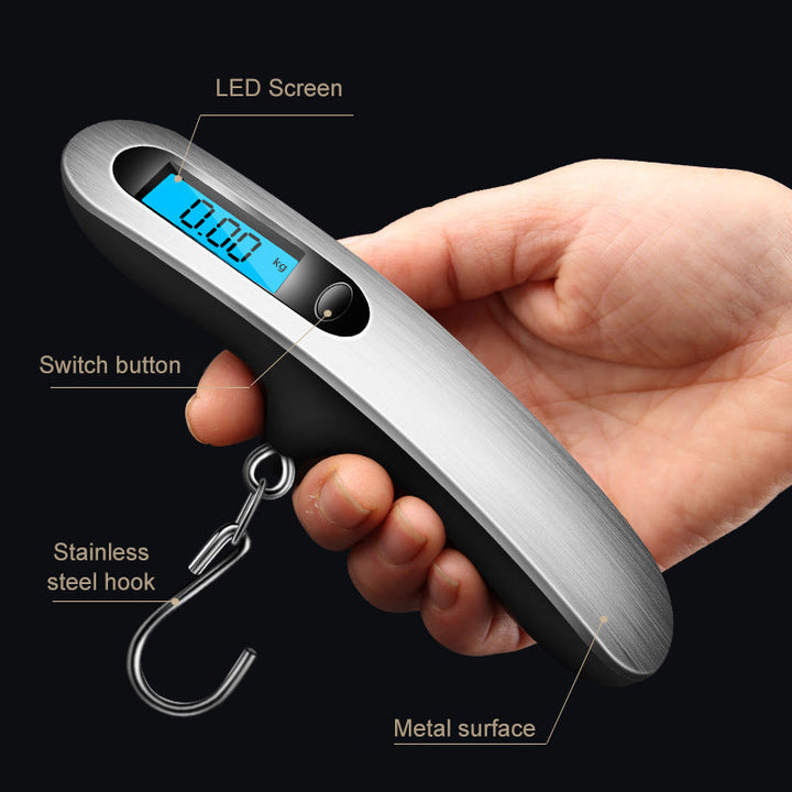 Close-up of the digital display of a 50kg capacity portable luggage scale, illuminated with clear numbers