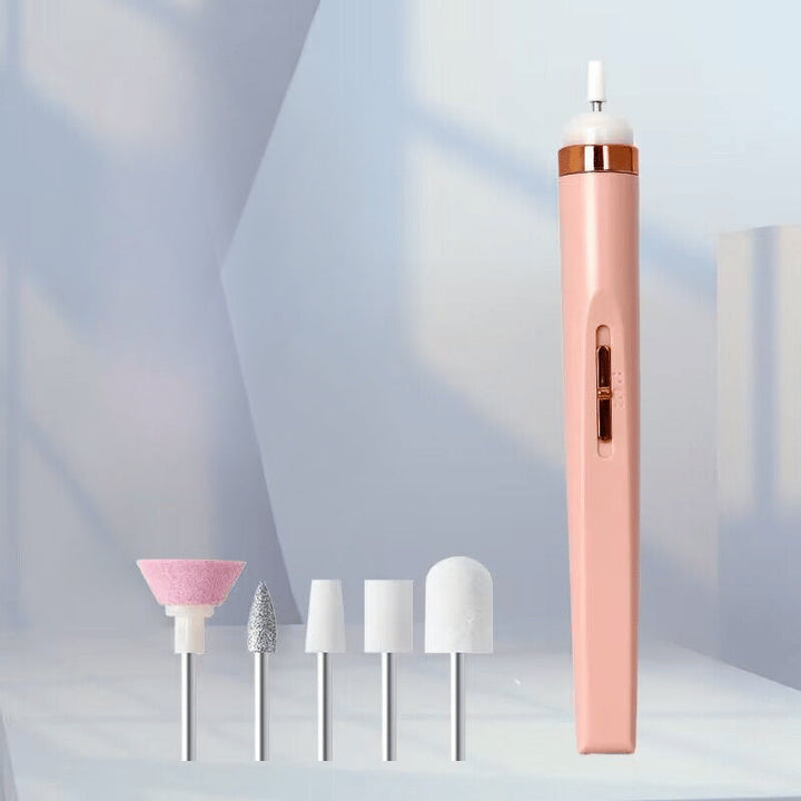 Woman's hand holding a compact electric nail drill for personal nail care grooming