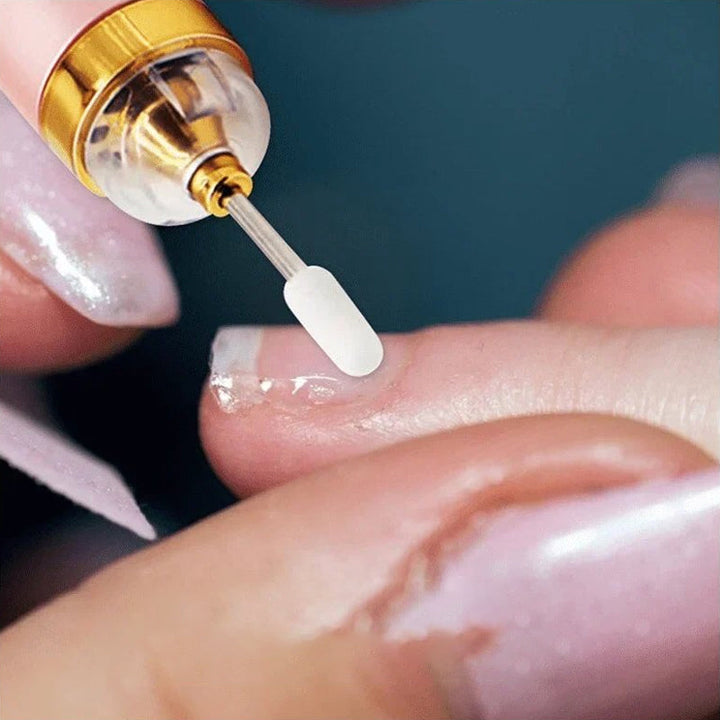Set of different grinding heads and polishing bits included with electric nail kit