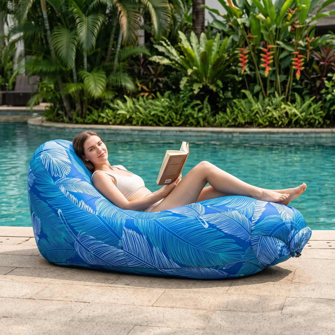 Portable inflatable outdoor lounge chair for beach, garden, or camping. Easy to carry and set up for summer relaxation.