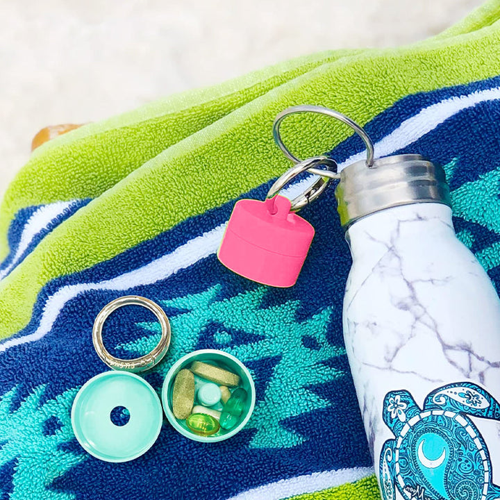 Multipurpose mini storage capsule with keychain, perfect for small items on the go