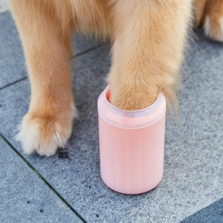 Dog paw cleaner cup, blue, with gentle silicone bristles for quick pet paw washing.