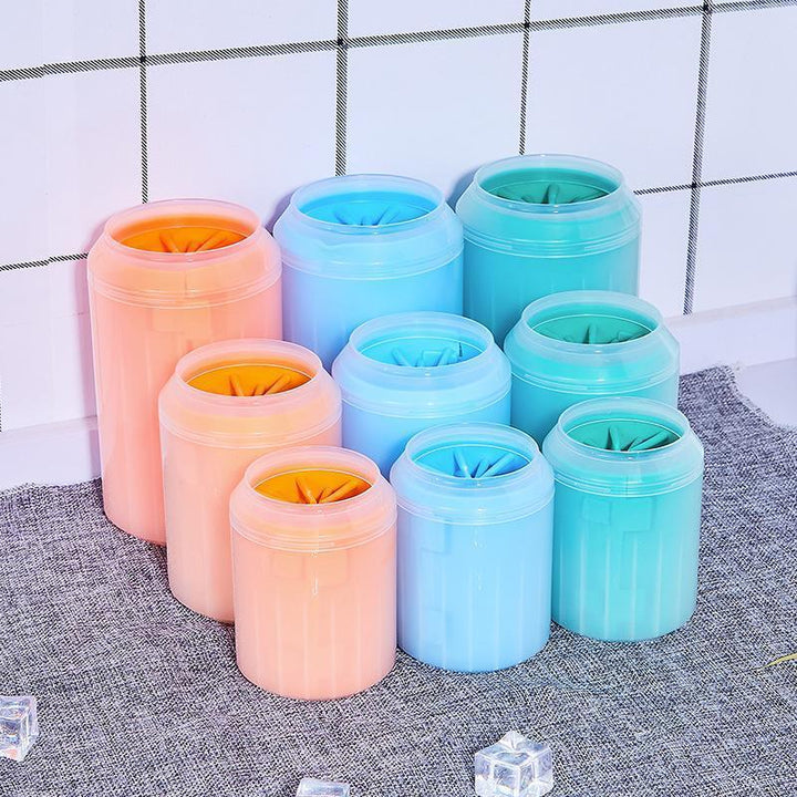 Dog paw washer with ergonomic design and flexible silicone brushes for comfortable use.