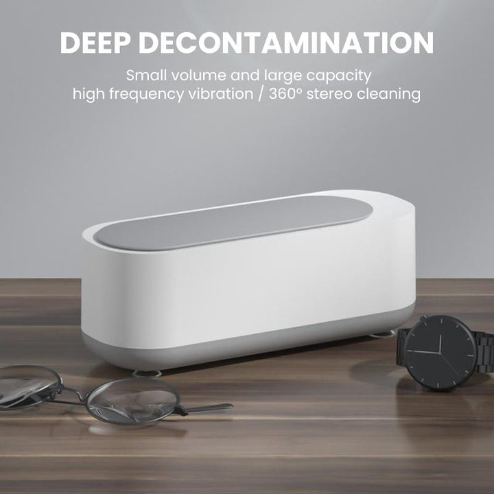 Portable ultrasonic cleaner on a bathroom counter, ready for daily hygiene routines